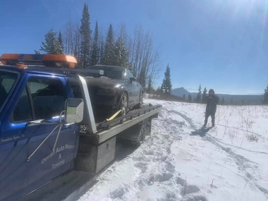 Flatbed towing service in snow